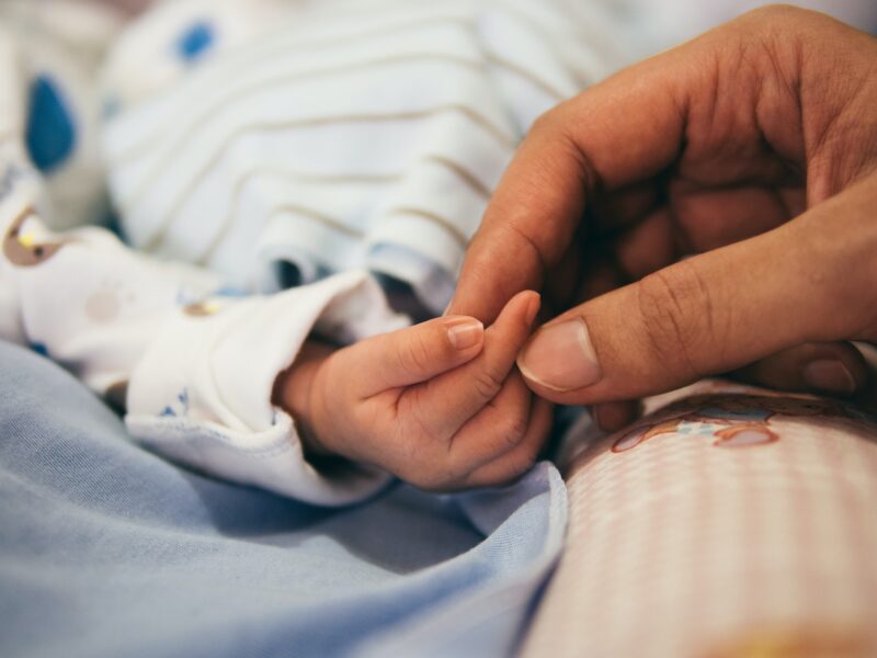 Holding Newborn Baby's Hand