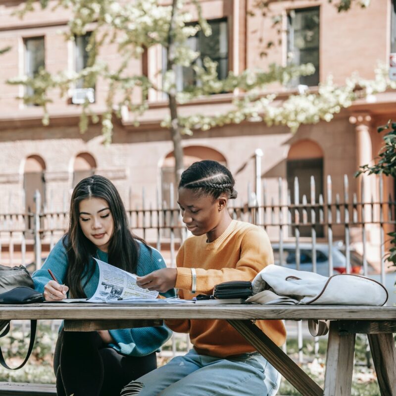students-reading-information-on-paper