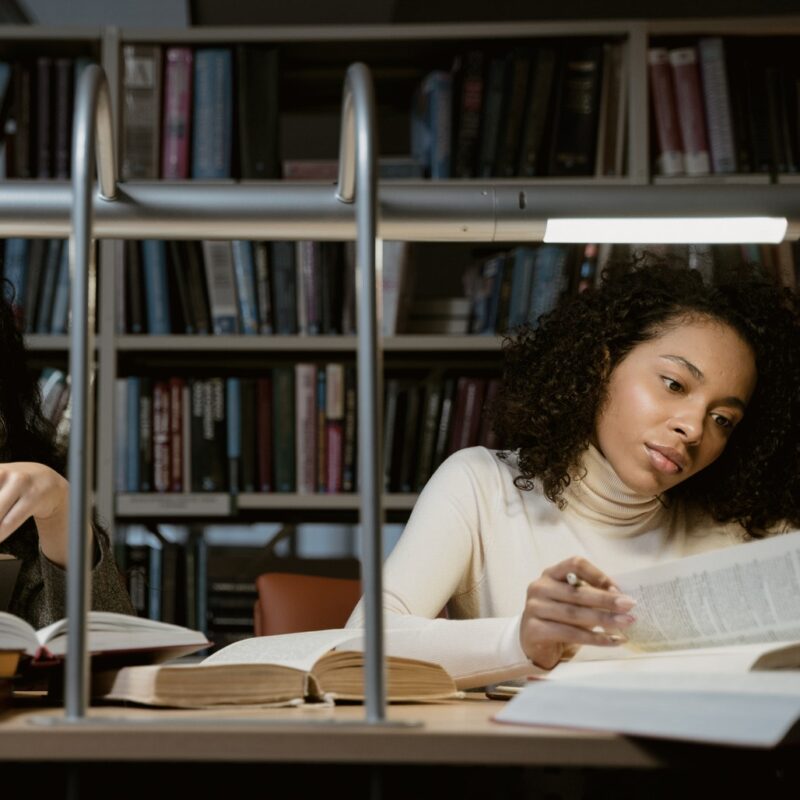 woman-in-the-library-reading-books-and-studying