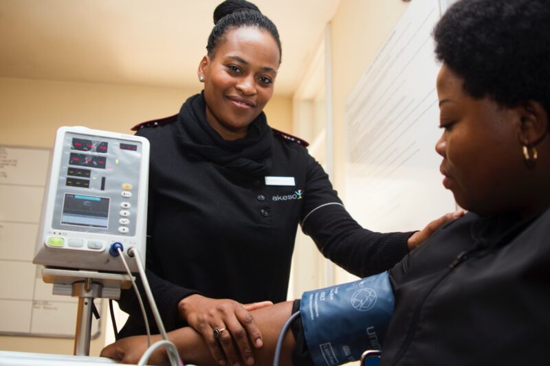 Nurse Measuring A Patient's Vitals