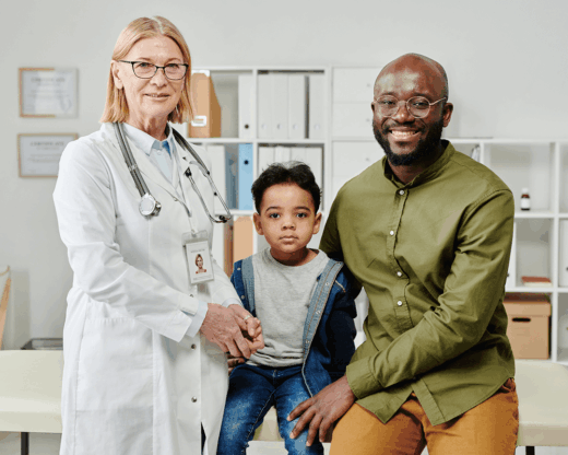father and son with pediatrician