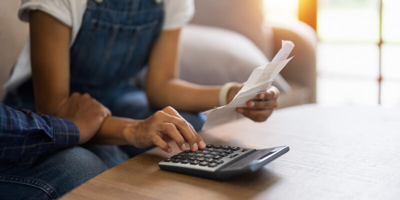 Person Calculating Healthcare Expenses